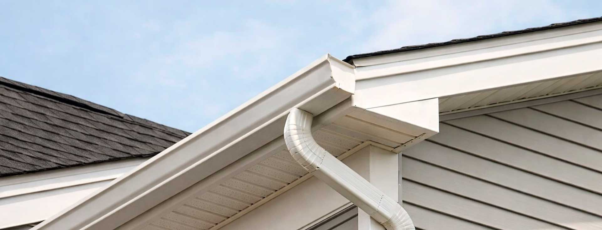 Seamless white gutter and downspout installed on a Central New Jersey home